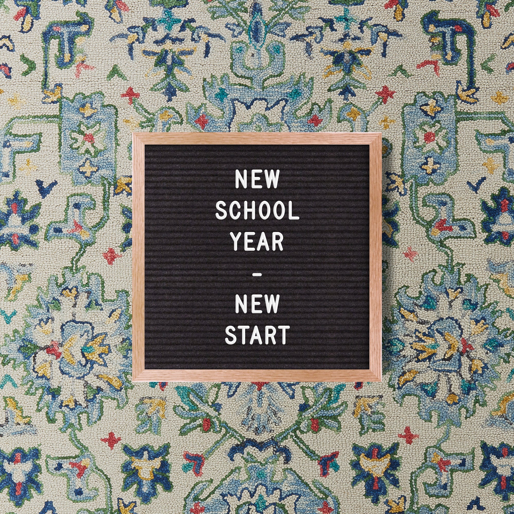 back to school sign on rug