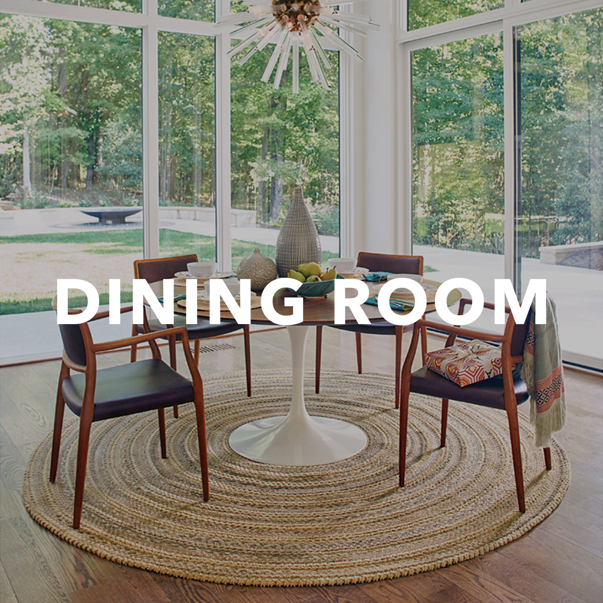 round golden braided rug under circular dining table with "dining room" written across in white