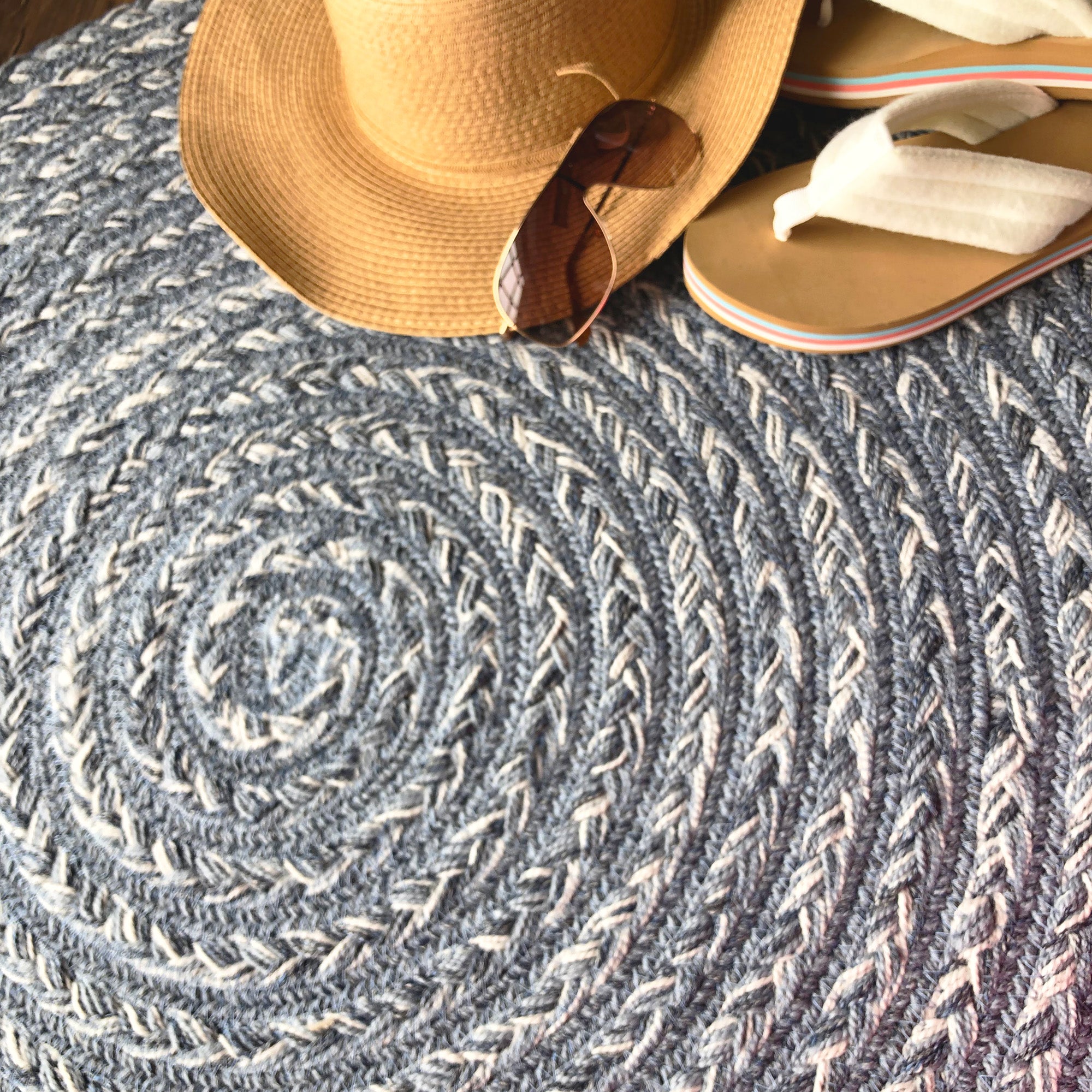 round braided rug with flip flops hat and glasses indoor outdoor rug coastal