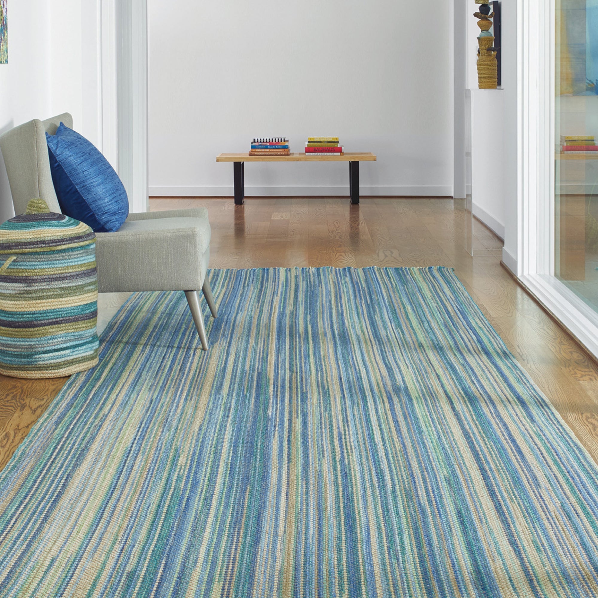 coastal home with woven rug hallway 